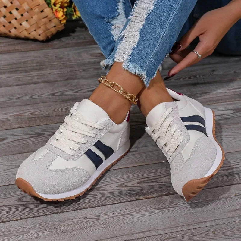 Comfortable women's retro colourblock sneakers with striped design & lace-up closure for casual everyday wear.