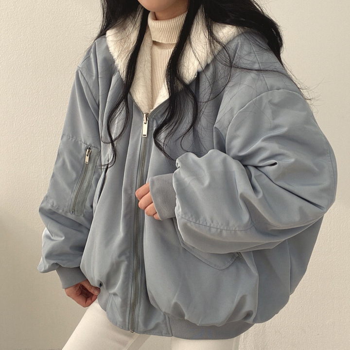 Women's reversible hooded jacket, cozy & versatile, perfect fall/winter layering piece.