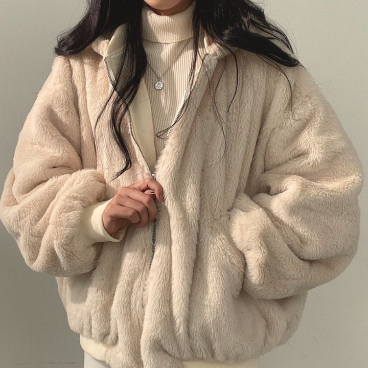 Cozy women's reversible hooded jacket, offering two stylish looks for fall and winter outfits.