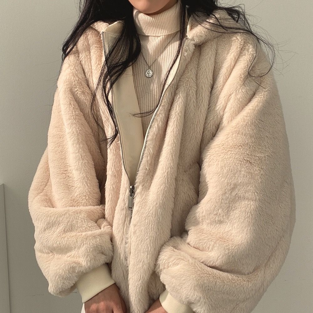 Versatile women's hooded jacket, reversible design for changing up your winter outerwear look.