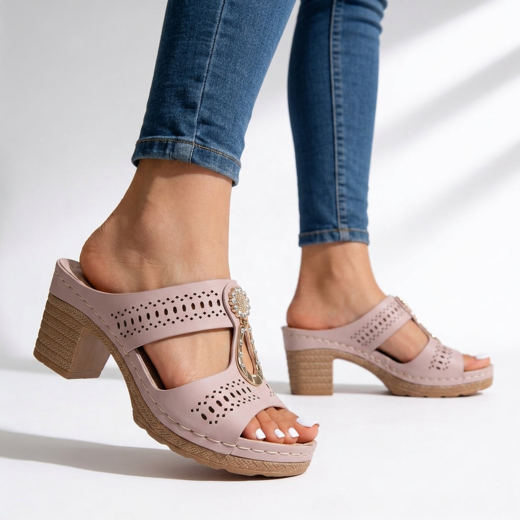 Stylish women's rhinestone block heel sandals offering cushioned comfort, versatile for both casual and dressy summer outfits.