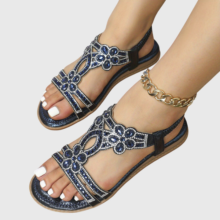 Glamorous women's flat sandals for summer parties, featuring intricate rhinestones.