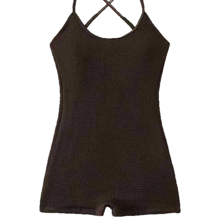 Woman enjoying the beach in a stylish, comfortable ribbed athletic one-piece monokini tank swimsuit.