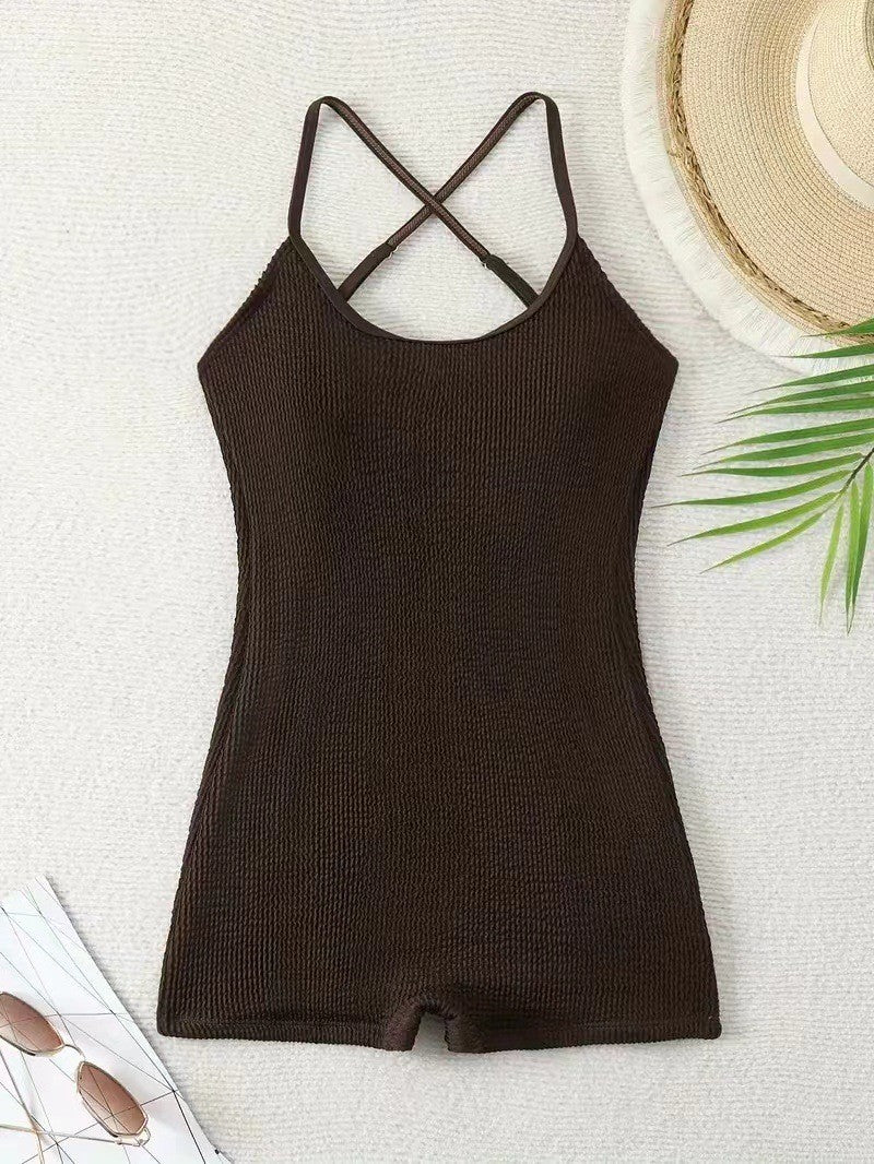 Energetic shot of a woman in an athletic ribbed one-piece tank monokini, perfect for beach sports & active swimming.