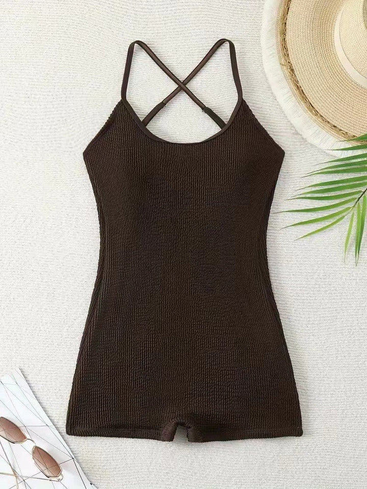 Energetic shot of a woman in an athletic ribbed one-piece tank monokini, perfect for beach sports & active swimming.