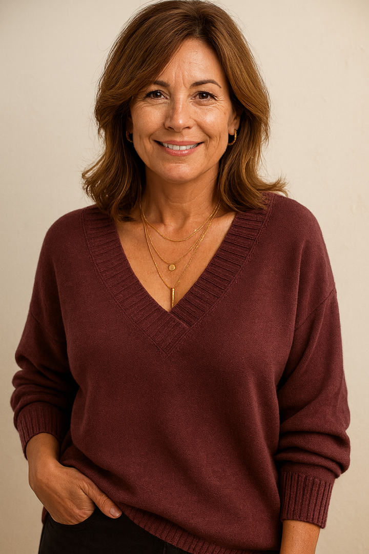 Chic relaxed fit women's ribbed v-neck sweater. Long sleeve, perfect for cozy fall/winter style.
