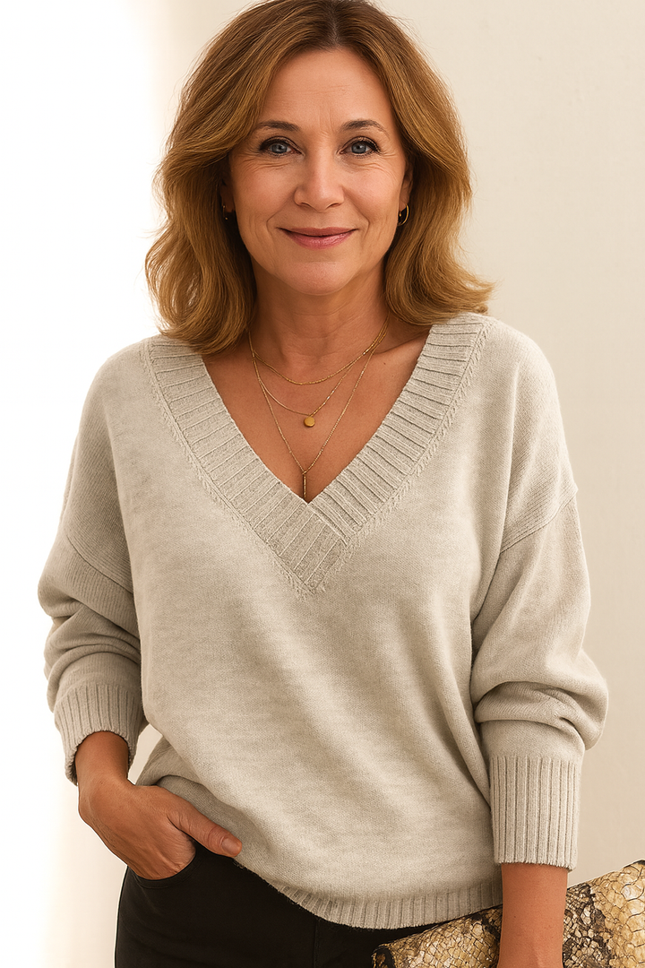 Casual & cozy women's ribbed v-neck sweater. Relaxed fit long sleeve, versatile fall/winter fashion.
