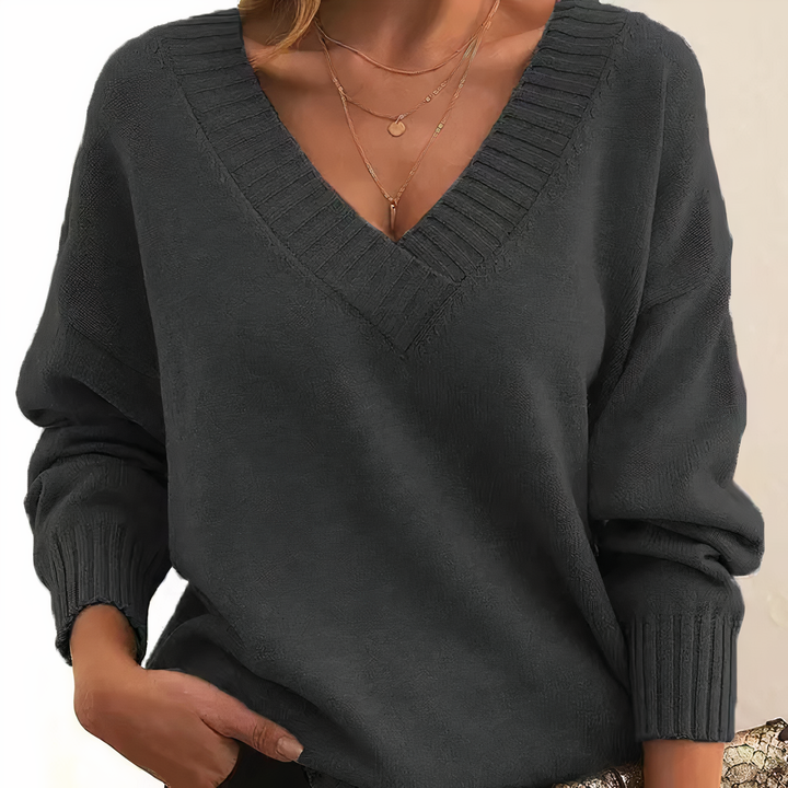 Comfortable relaxed fit women's ribbed v-neck sweater with long sleeves. Ideal for fall & winter style.
