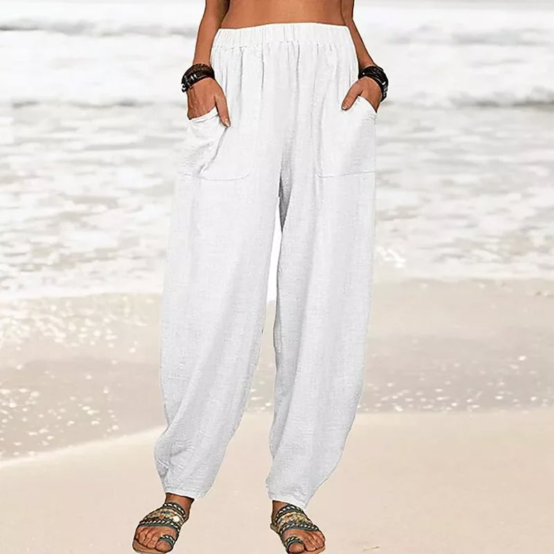 Women's Rizza relaxed fit beach pants in a light color, styled for effortless summer fashion & comfort.
