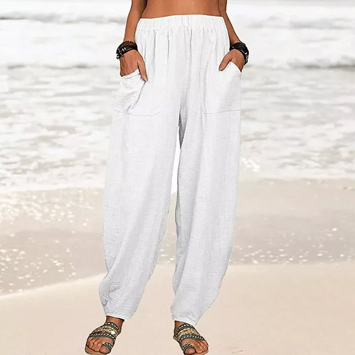 Women's Rizza relaxed fit beach pants in a light color, styled for effortless summer fashion & comfort.