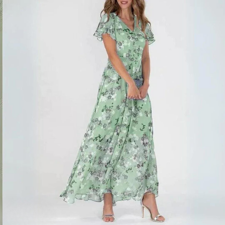 Women's summer romantic floral maxi dress with elegant flutter sleeves. Bohemian v-neck style, perfect for vacation.