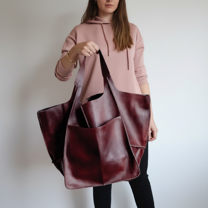 Modern women's roomy faux leather tote. Stylish and practical everyday shoulder bag for work.
