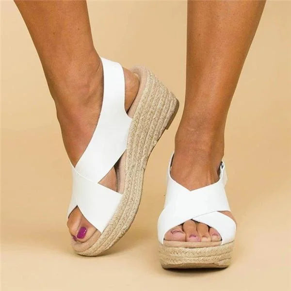 Fashionable women's open-toe rope wedge platform sandals with elegant crisscross straps.