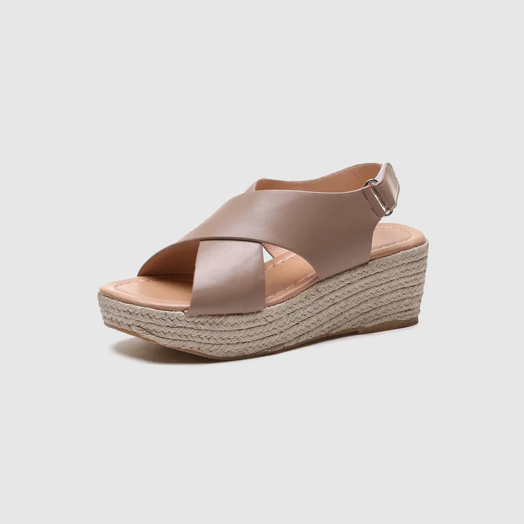 Chic women's open-toe platform sandals featuring a trendy rope wedge and crisscross straps.