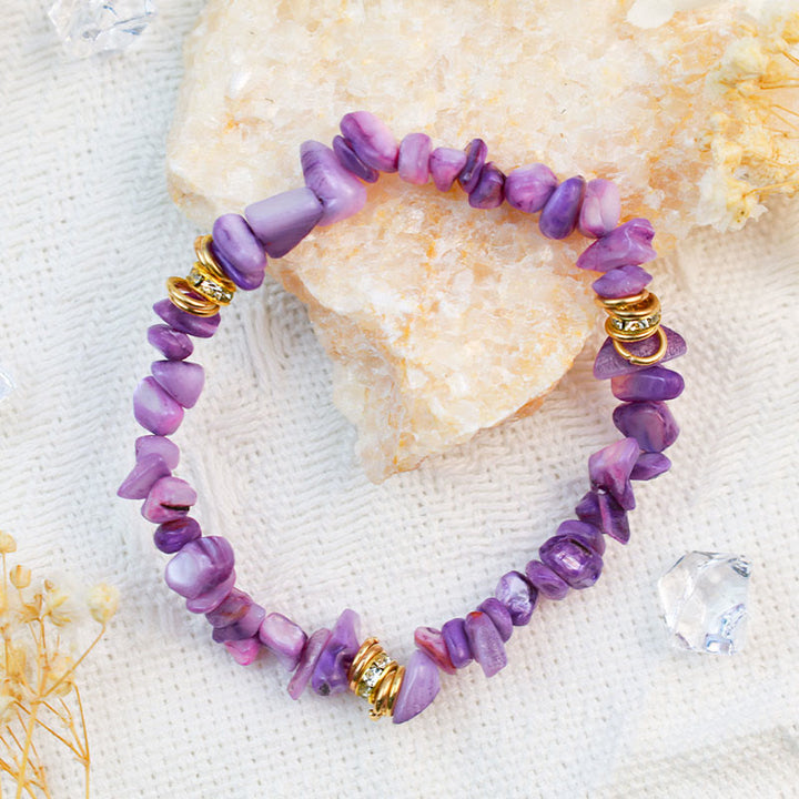 Garnet natural stone crystal healing bracelet for women. Energizing gemstone fashion accessory.