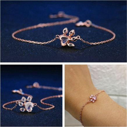 Hypoallergenic women's bracelet featuring rose quartz and a rose gold paw print design, pet themed jewelry