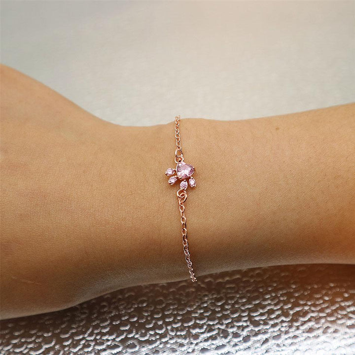 Rose Quartz Paw Print Bracelet for women, rose gold finish, ideal animal jewelry for pet enthusiasts