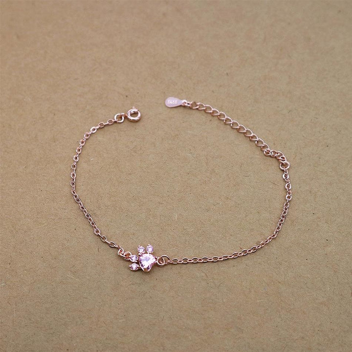 Pet themed rose quartz and rose gold paw print bracelet, hypoallergenic for sensitive skin wearers