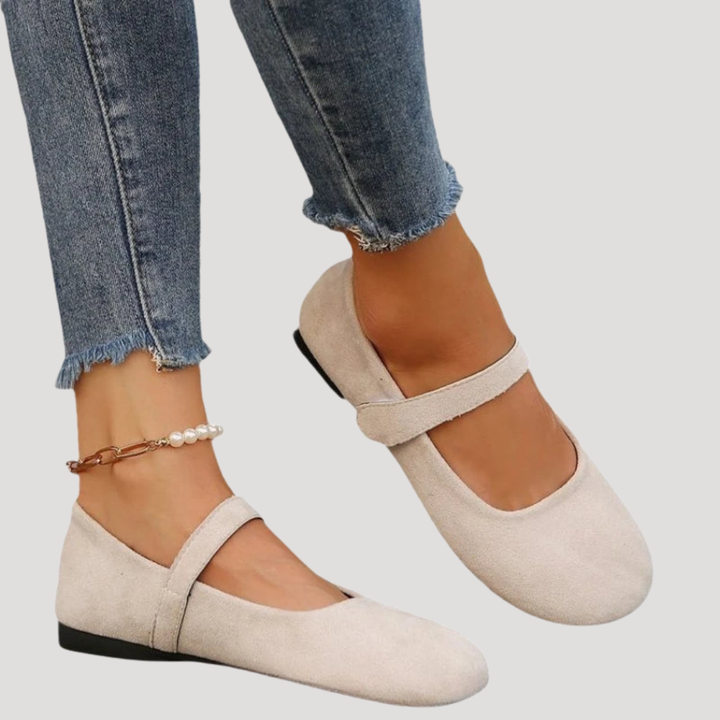 Classic round toe women's Mary Jane flats featuring an adjustable Velcro strap for a secure, comfortable fit.