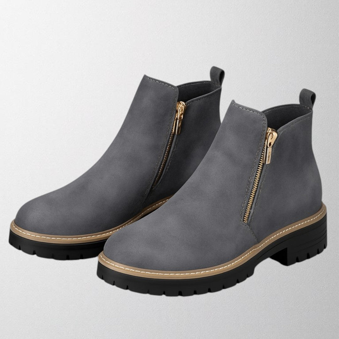 Modern women's round toe footwear with a convenient side zip, offering comfortable & versatile style.