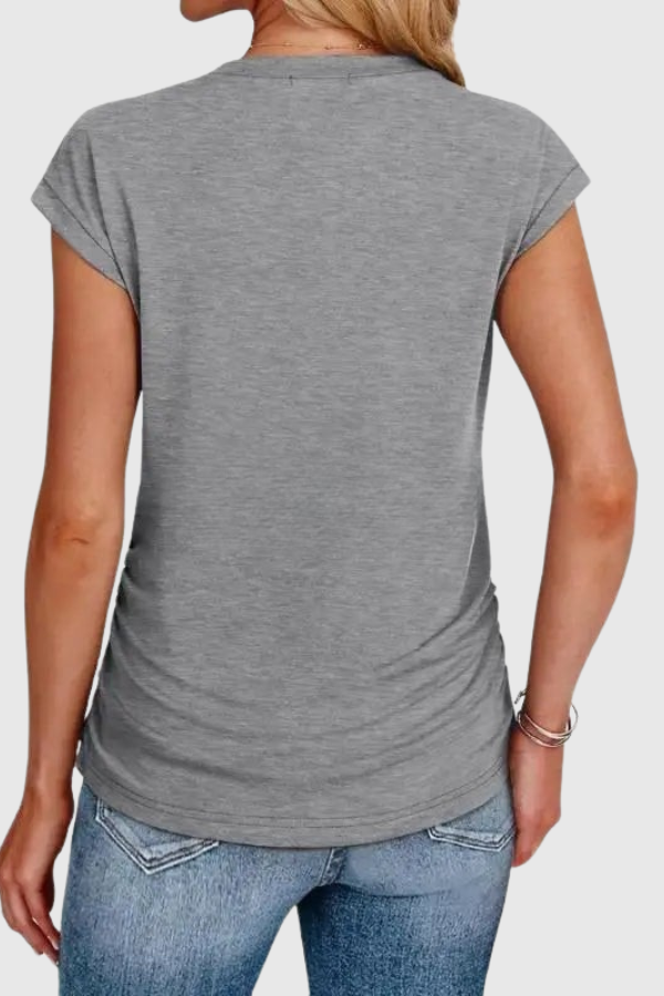 Stylish women's ruffle sleeve tunic blouse with ruched sides for comfortable casual wear.