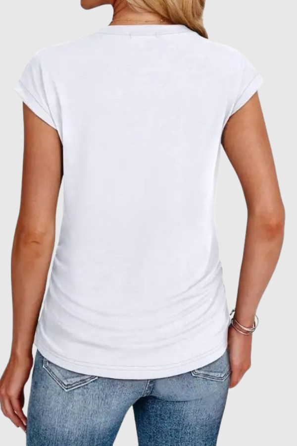 Casual women's tunic top featuring chic ruched sides and comfortable relaxed fit.