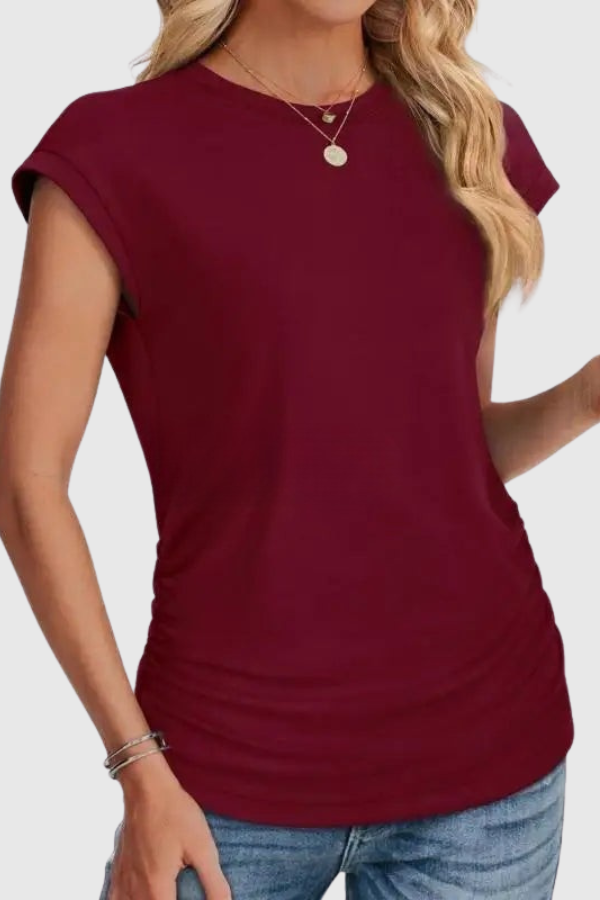 Comfortable women's casual blouse, a ruched side tunic top with a relaxed fit.