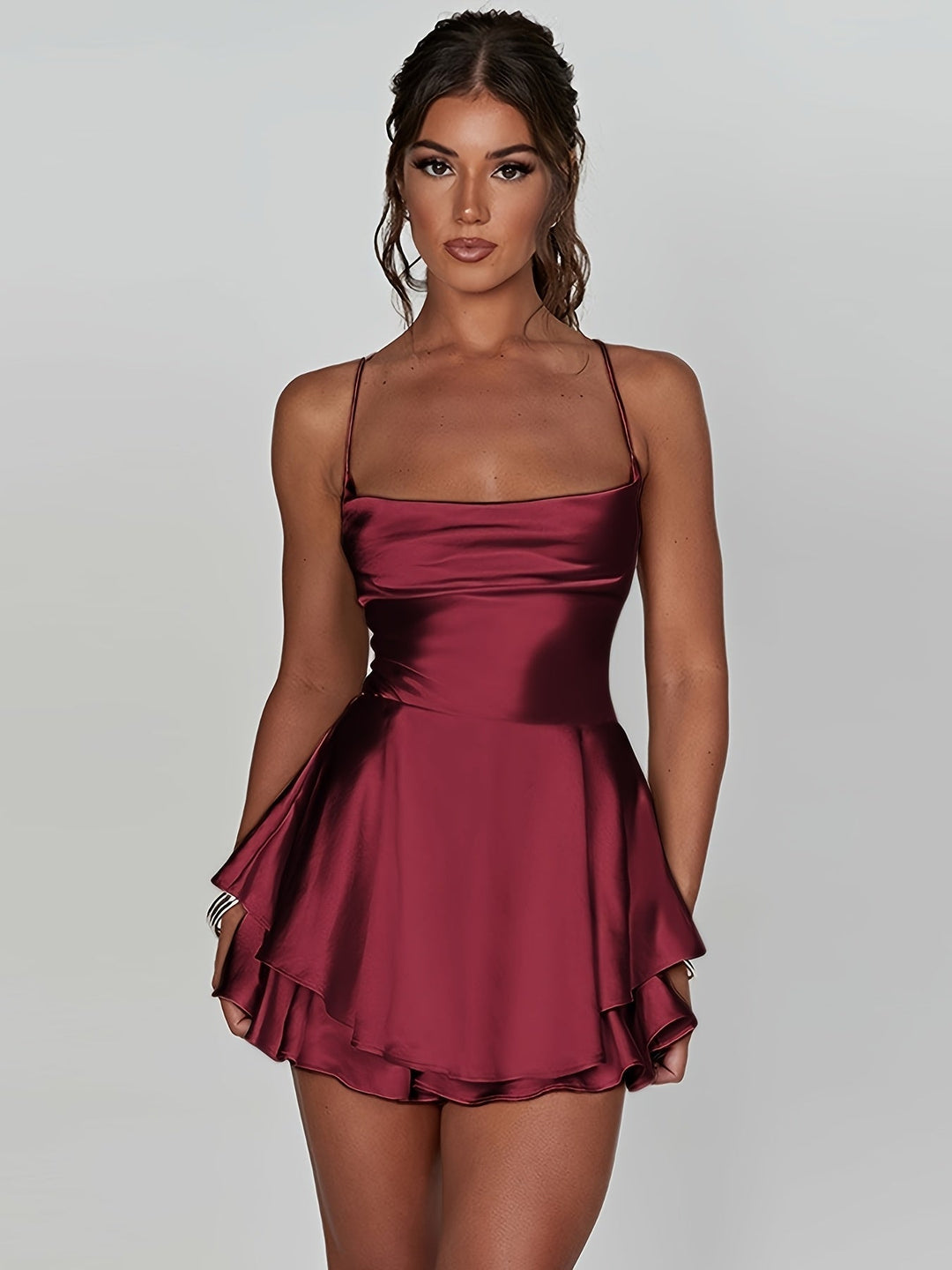 Women's ruched tiered mini dress for homecoming. Elegant party wear with adjustable straps.