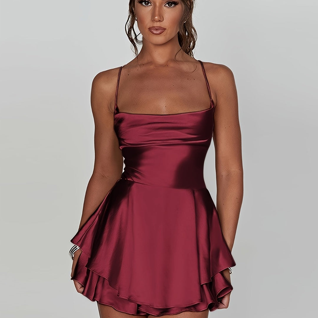 Women's formal mini dress, ruched and tiered for elegant occasions. Comfortable adjustable straps.