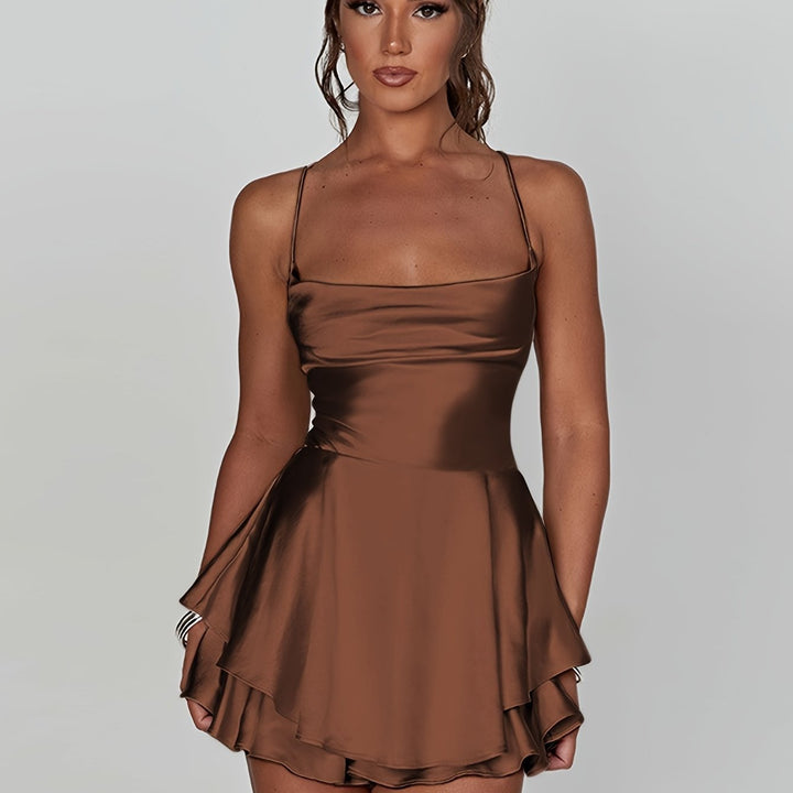 Homecoming women's tiered mini dress, elegant ruched finish. Adjustable strap design.