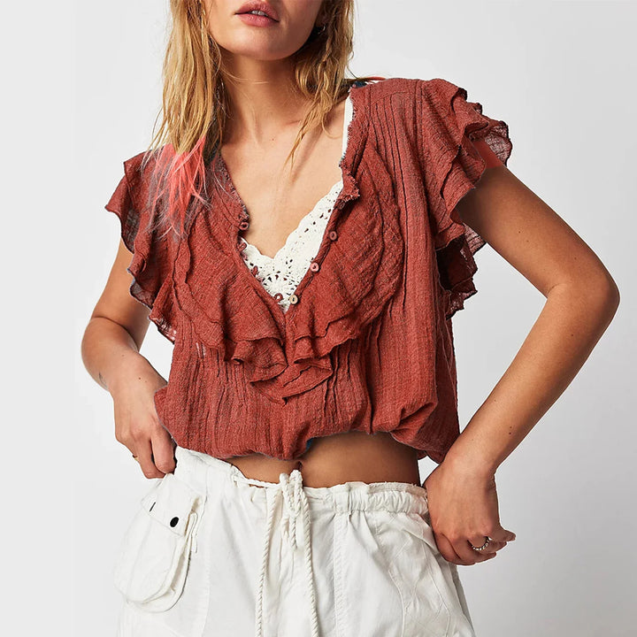 Women's ruffle front crop top, airy beach style for summer fashion.