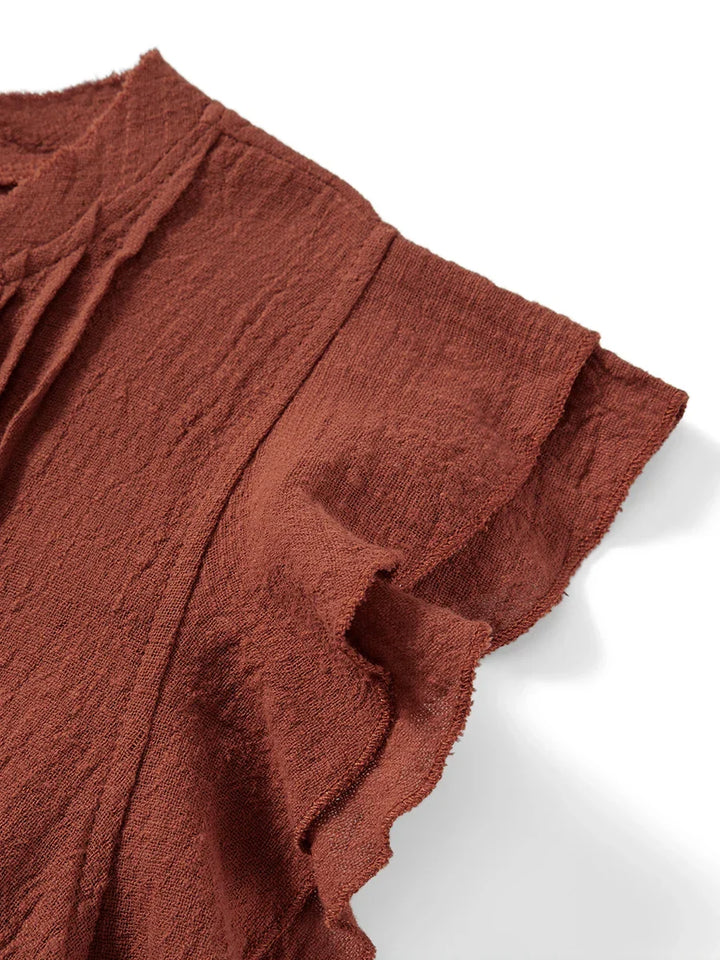 Women's airy ruffle front crop top with delicate flutter sleeves for summer fashion.