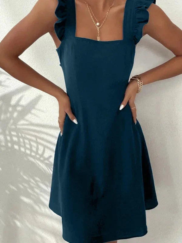 Casual A-line women's mini dress with playful ruffle straps, square neck, & a pretty bow on the back.