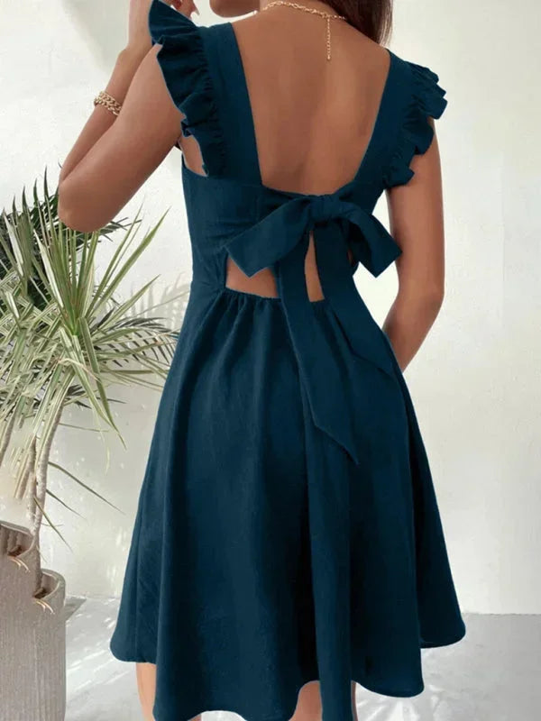 Stylish women's square neck mini dress, complete with delicate ruffle straps & an elegant bow back closure.