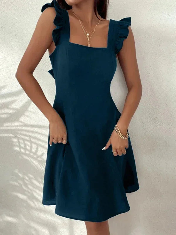 Women's feminine summer mini dress: Ruffle straps, square neck, A-line fit, and an adorable bow tie back.