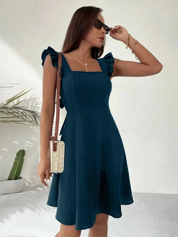 Elegant women's casual mini dress with ruffle straps, a square neckline, and a sophisticated bow back accent.