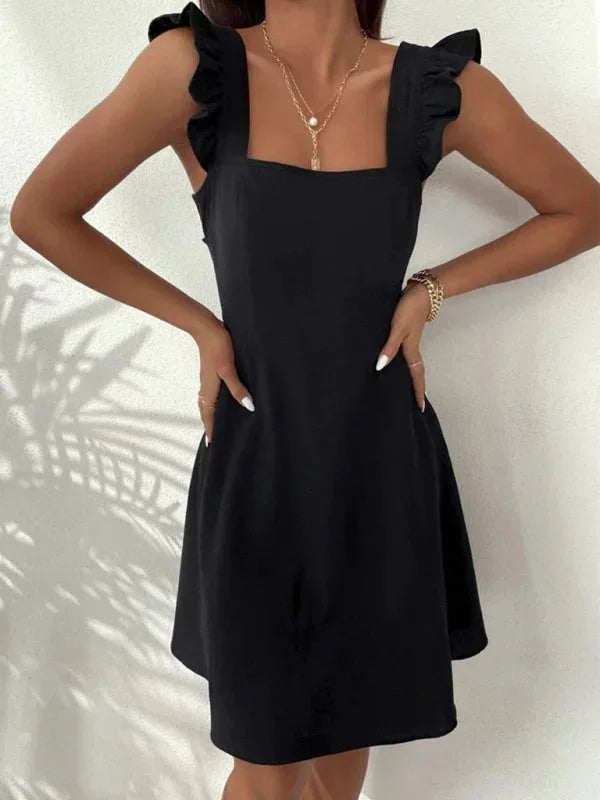 Women's strappy A-line mini dress, perfect for summer, featuring ruffle straps, square neck & bow back.