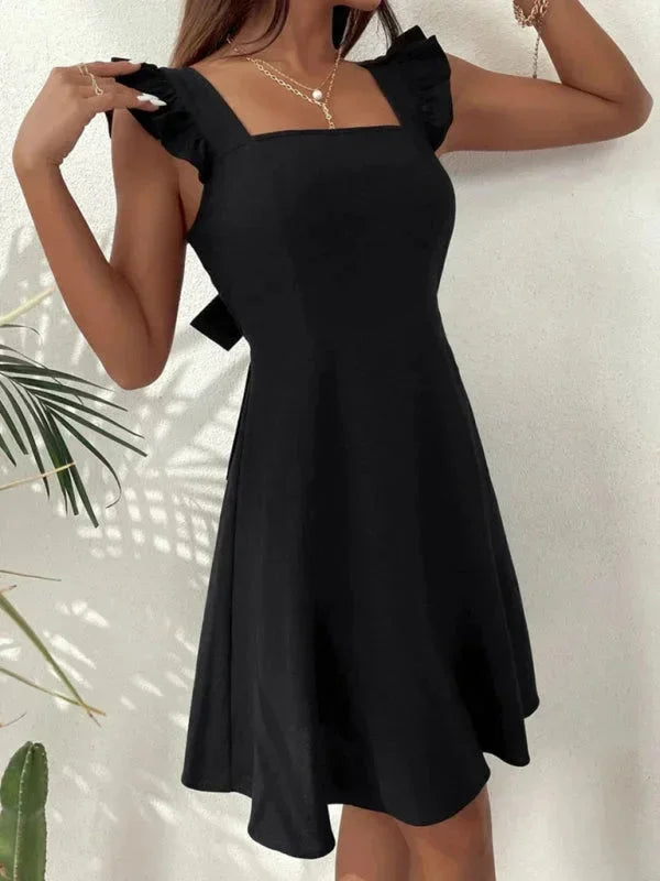 Versatile women's ruffle strap mini dress: Square neck, A-line silhouette, and a pretty bow-back detail.