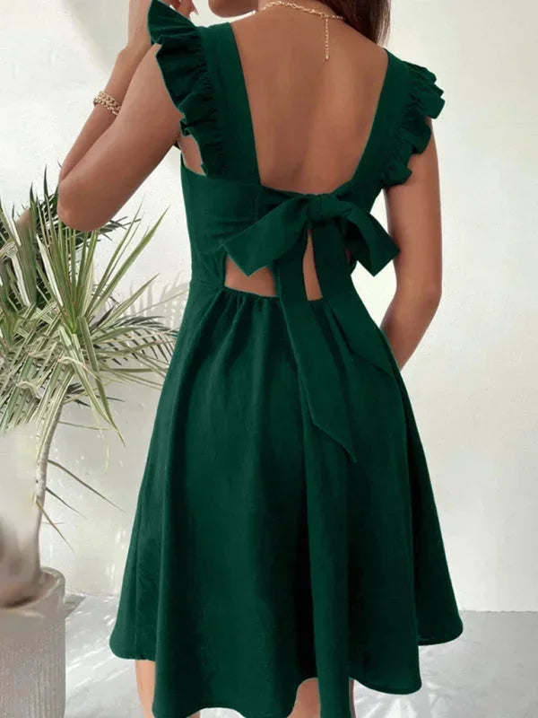 Casual women's square neck mini dress with playful ruffle straps & an elegant bow tie back. Ideal for summer.