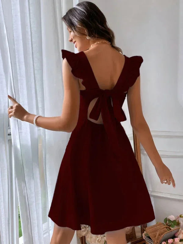 Women's fashionable A-line mini dress featuring flirty ruffle straps, a flattering square neck & bow detail.