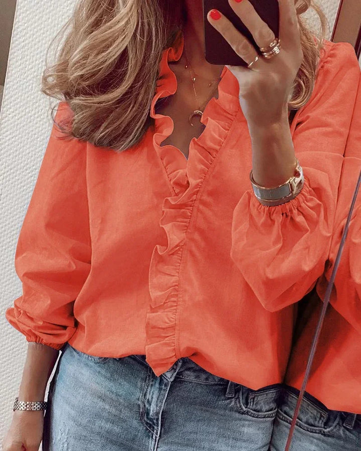 Women's ruffle v-neck long sleeve blouse, perfect for casual chic or elegant outfits.
