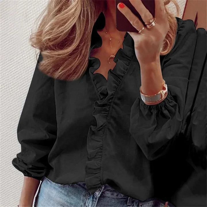 Comfortable women's long sleeve blouse with v-neck, ruffles & relaxed fit. A stylish button-front top.