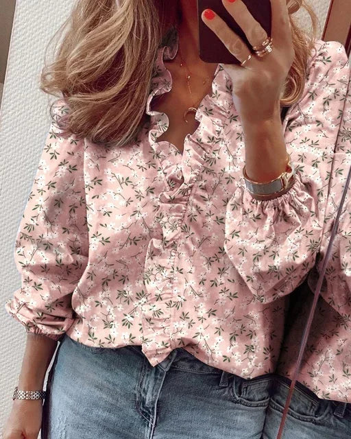 Stylish women's ruffle V-neck blouse. Long sleeves & button front detail. Perfect versatile fashion top.