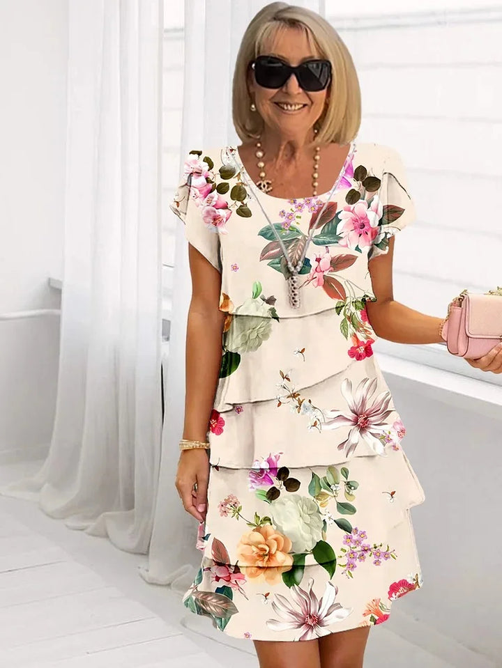 Chic women's floral ruffled midi dress with pleated skirt & adjustable straps, ideal for summer fashion & day wear.