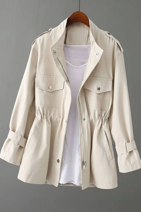 Stylish women's rugged utility jacket with a unique open back feature, perfect for modern casual outerwear.