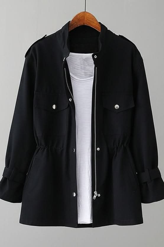 Women's rugged utility jacket with a fashionable open back. Ideal outerwear for casual, modern street style looks.