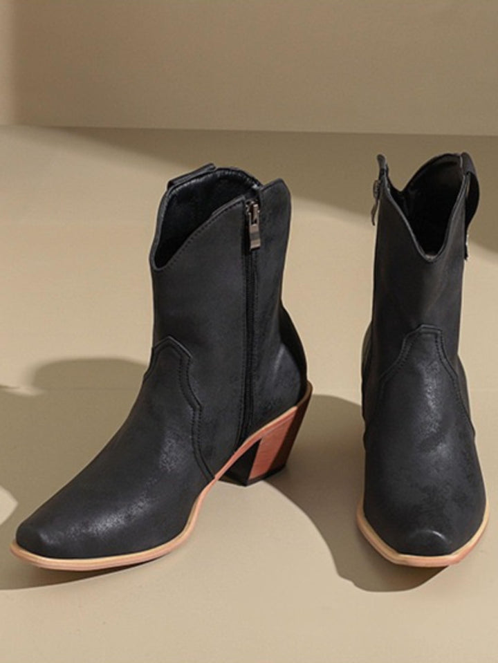 Rustic black snip toe cowgirl boots for women. Wide calf western fashion boots with comfortable mid block heel.