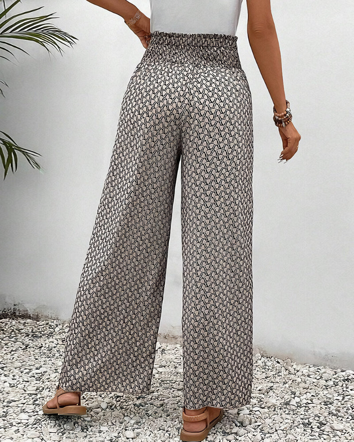 Flowy women's Sahara wide-leg pants with elastic waist. Comfortable, versatile, and relaxed for spring & summer style.