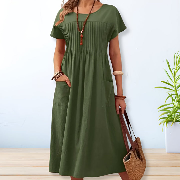 Chic women's Savannah relaxed fit midi day dress with short sleeves & practical pockets. Perfect for spring/summer comfort.