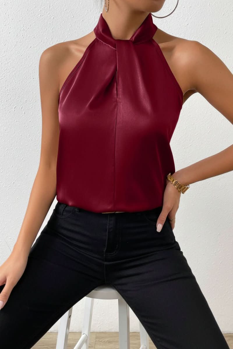 Women's elegant sleeveless blouse with a distinctive halter knot, ideal for stylish work or casual outings.